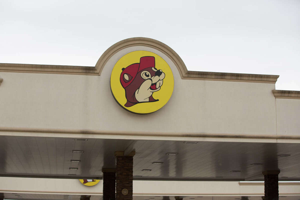 Holiday travelers stop to strike a pose outside the Buc-ee's on Interstate 35 just outside San Antonio on Wednesday, Nov. 27, 2019. They were among the 49.3 million motorists on road this Thanksgiving holiday, according to AAA.