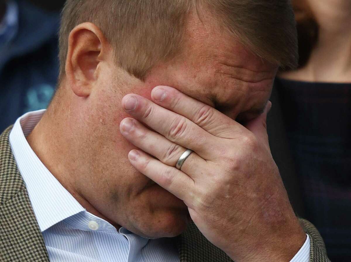 Darien man Scott Hapgood wipes away a tear beside his wife, Kallie Hapgood, at Town Hall in Darien, Conn. Monday, Oct. 28, 2019 as U.S. Sen. Richard Blumenthal, D-Conn., and the town show support for him in his manslaughter charge from a family vacation in Anguilla. Hapgood is facing a manslaughter charge regarding the death of a man who the family says attacked Hapgood in his hotel, forcing him to defend himself and his family. A revised autopsy report, based on new toxicology tests, determined the man died from a lethal dose of cocaine and not from injuries he sustained in the fight. U.S. Sen. Blumenthal, Darien First Selectman Jayme Stevenson, and friends and family are asking for a fair and transparent trial, as well as guaranteed safe passage, as Hapgood returns to Anguilla to face charges.