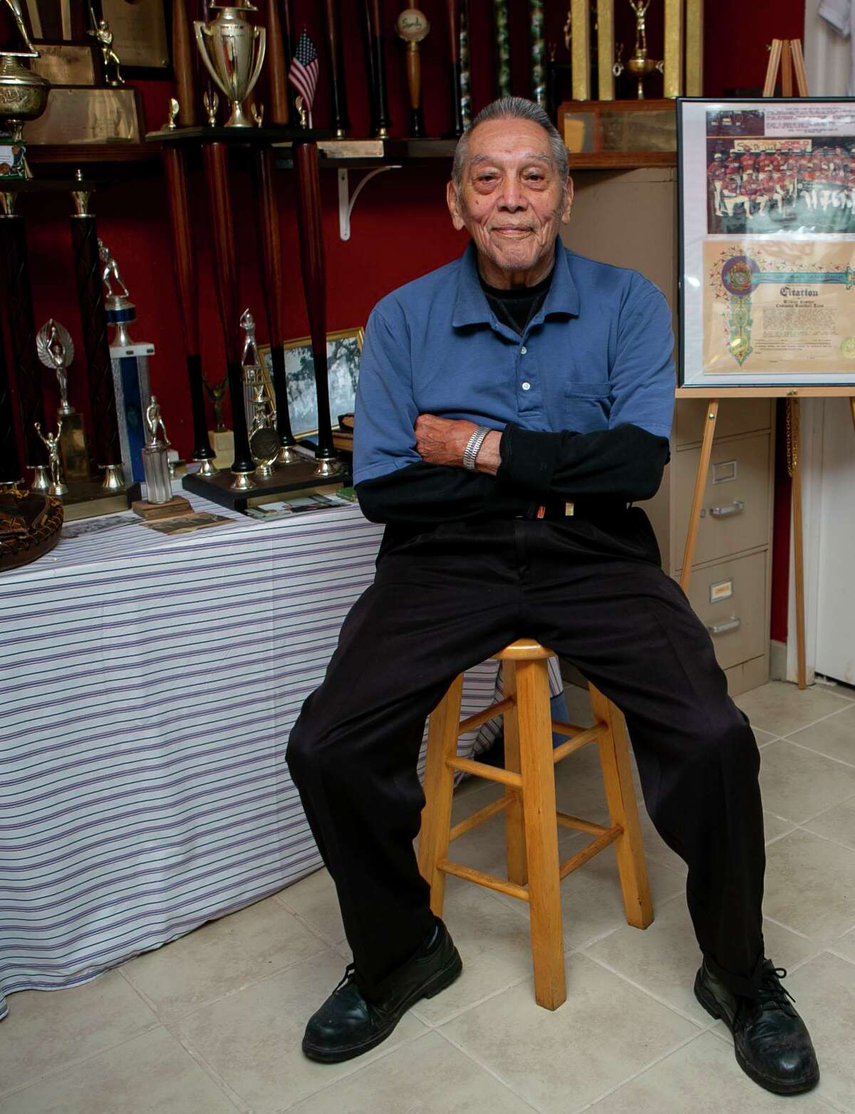 Willie Doria, 95, is one of the last living stars of the Spanish American Baseball League, poses at home of Joe Sanchez, a lifelong friend and the former manager of the league, in San Antonio, Texas on Nov. 26, 2019.