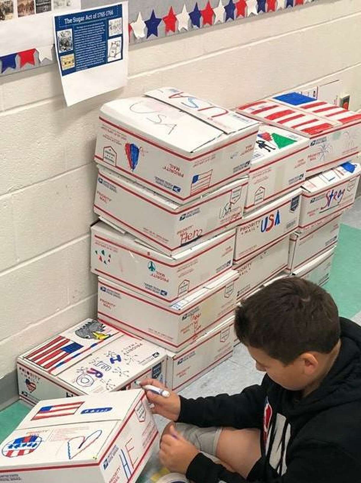 Seymoyur Middle School students made care packages for troops overseas for the holidays.