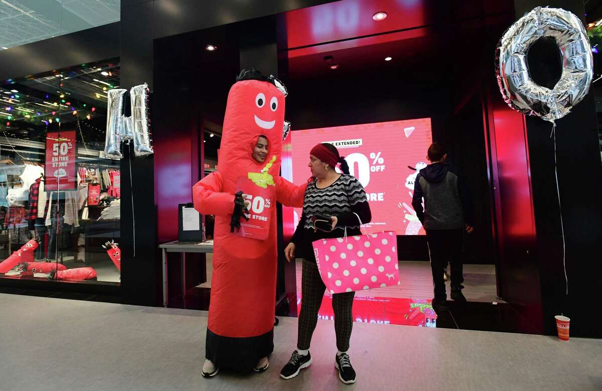 Shoppers search for Black Friday deals at the SoNo Collection mall Friday, November 29, 2019, in Norwalk, Conn.
