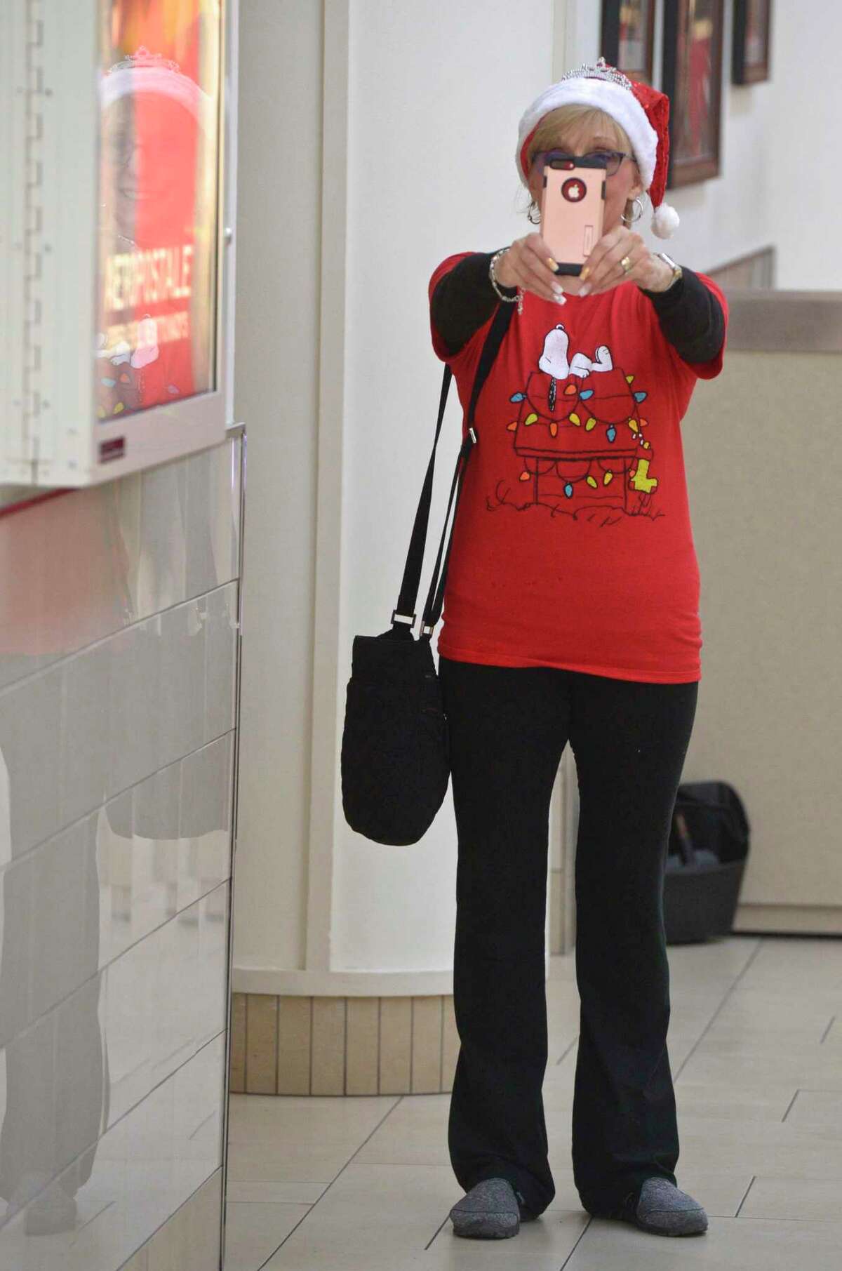 Traci Wallerstein, of Yorktown Heights, NY, takes a selfie to prove to a friend she was really Black Friday shopping. Wallerstein, who got to the Danbury Fair mall at 7 AM, said