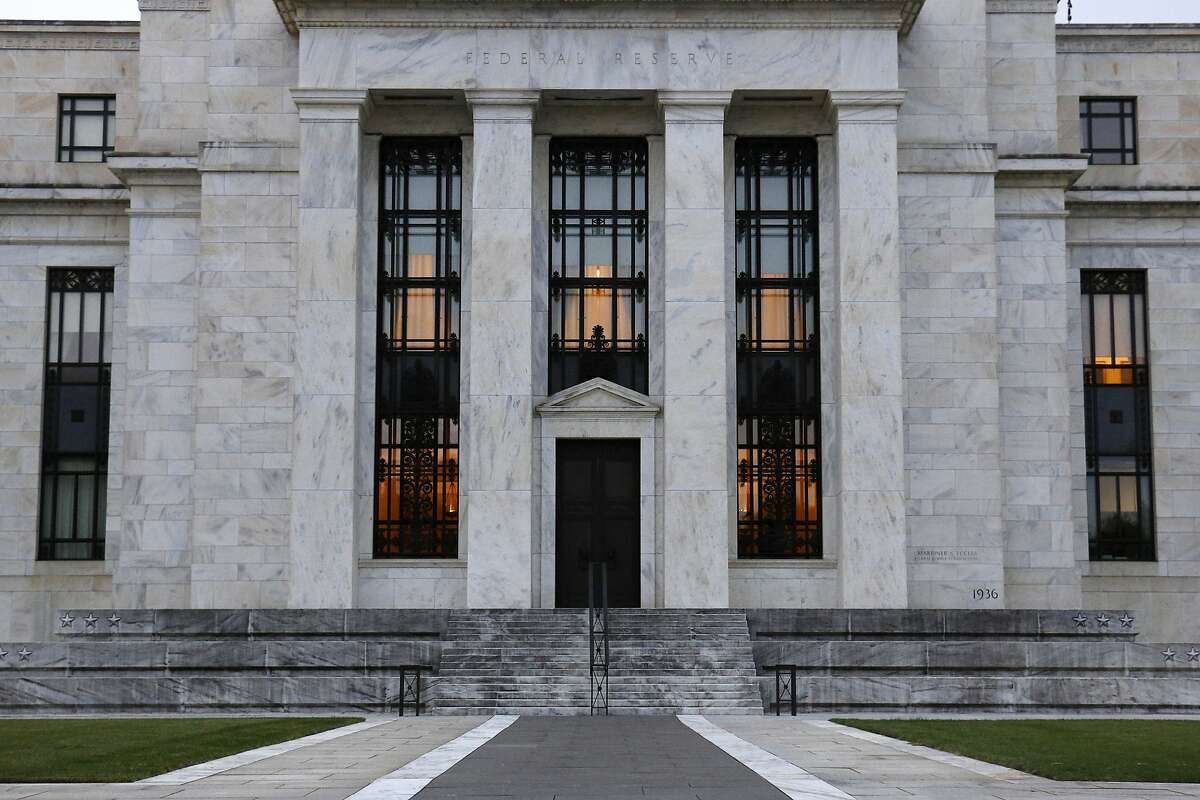 File-This July 31, 2019 file photo shows the Federal Reserve Building in Washington. The Federal Reserve says corporate debt remains at historically high levels but overall the U.S. financial system is resilient, a view in sharp contrast to the problems that led to the 2008 financial crisis. (AP Photo/Patrick Semansky, File)