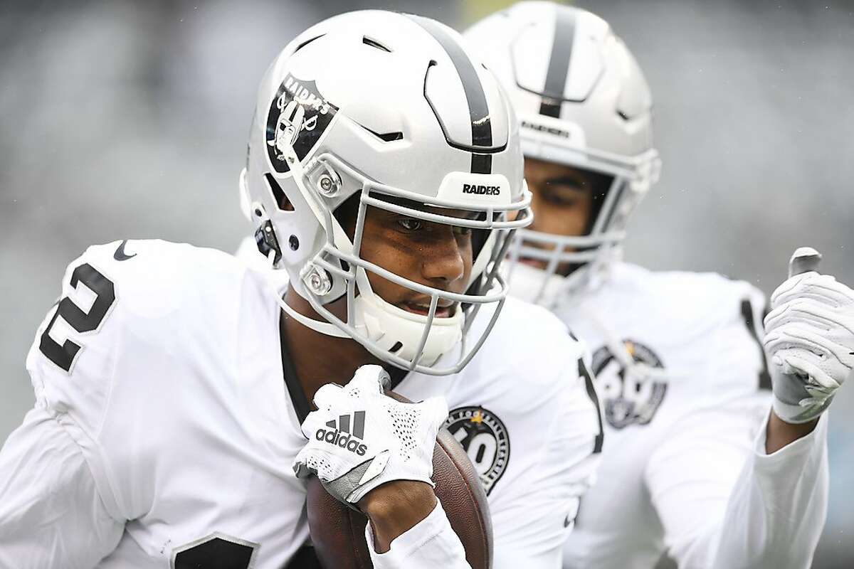 EAST RUTHERFORD, NEW JERSEY - NOVEMBER 24: Zay Jones #12 of the Oakland Raiders carries the ball during warmups prior to the game against the New York Jets at MetLife Stadium on November 24, 2019 in East Rutherford, New Jersey. (Photo by Sarah Stier/Getty Images)