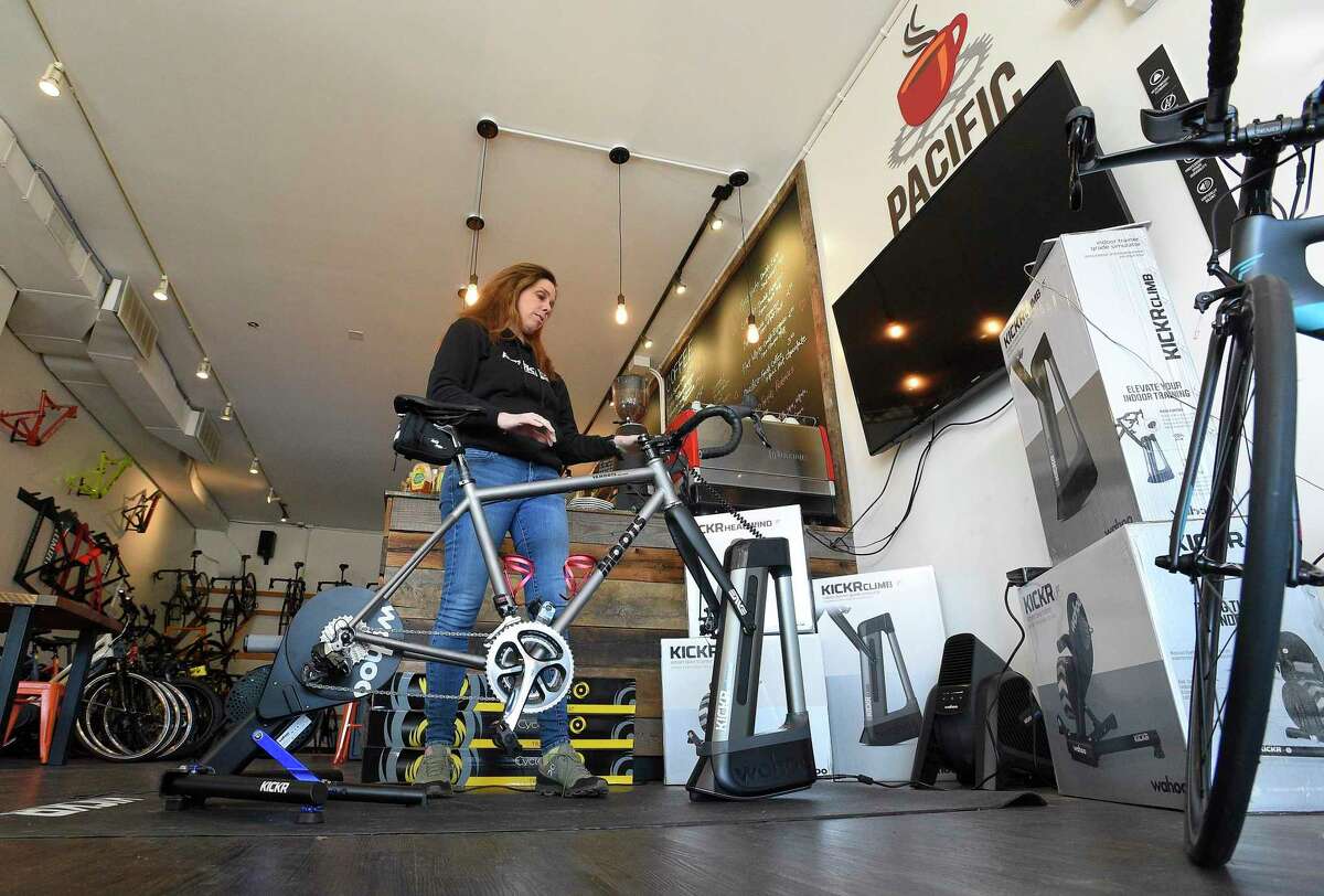 Julie Gabay, owner of Pacific Cycling and Triathlon, stands in the cafe of her store at 984 High Ridge Road in Stamford, Conn., on Nov. 29, 2019. Despite no longer having an online store, the business has already beaten its 2018 sales, according to Gabay.