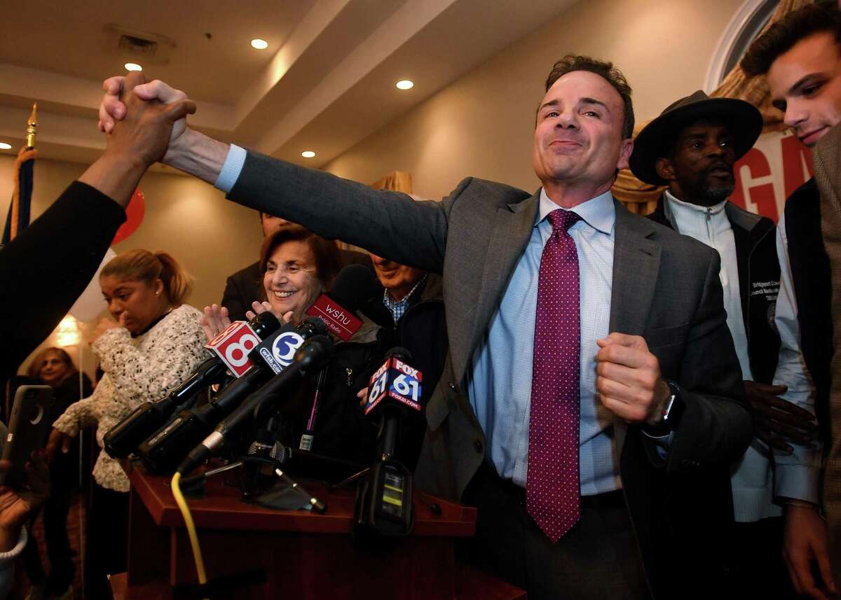 Bridgeport Mayor Joe Ganim is congratulated by supporters as he arrives at the podium to deliver his victory speech at Testo's Restaurant in Bridgeport, Conn. on Tuesday, November 5, 2019.