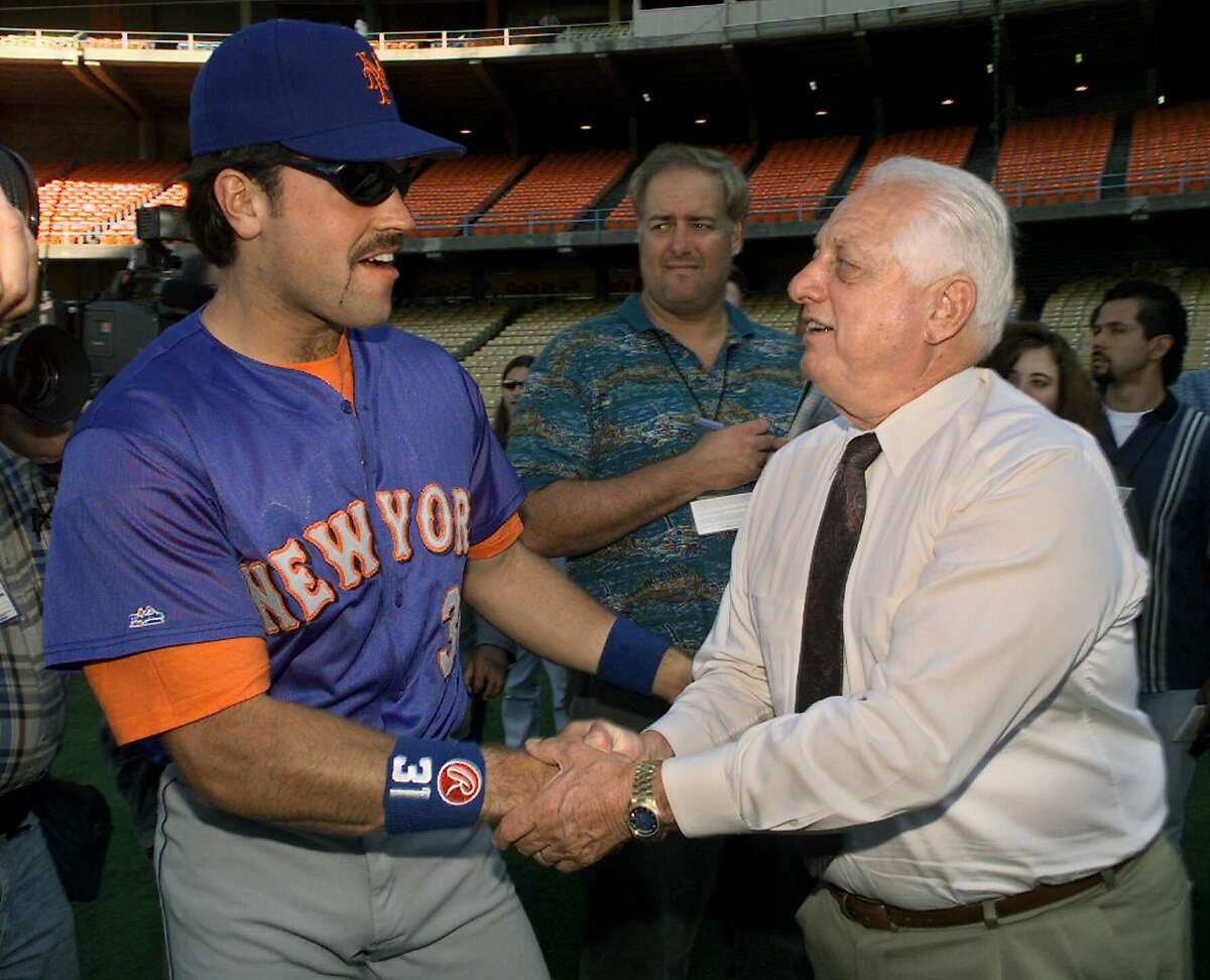 New York Mets' Mike Piazza greets his former manager Tommy Lasorda, who is the interim general manager of the Los Angeles Dodgers, Friday, Aug. 28, 1998, prior to the start of the game in Los Angeles. Piazza was making his first return to Dodger Stadium after being traded to Mets earlier this year. (AP Photo/Kevork Djansezian)