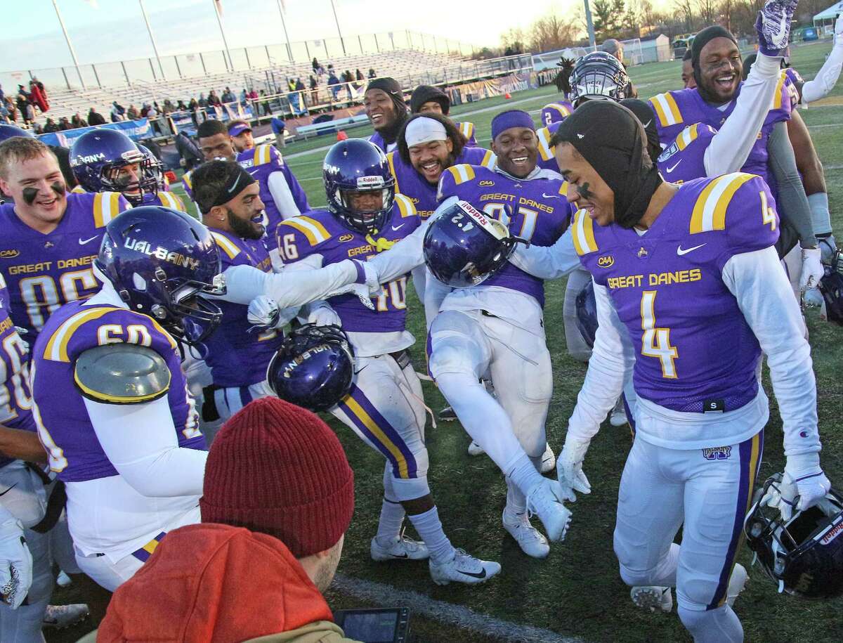 UAlbany football players dance in celebration after their 42-14 victory over over Central Connecticut State after the NCAA playoff at UAlbany on Nov. 30, 2019 in Albany, N.Y.
