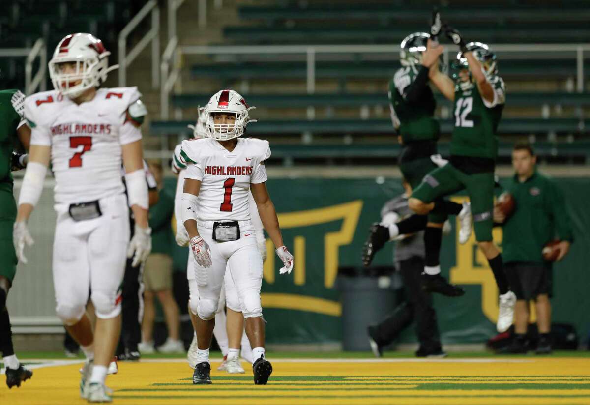 The Woodlands defensive back Kennedy Stewart (1) reacts as Prosper quarterback Jackson Berry (5) and wide receiver Hayden Metcalf (12) celebrate their 13-yard touchdown during the third quarter of a Region II-6A semifinal high school football playoff game at McLane Stadium, Saturday, Nov. 30, 2019, in Waco.