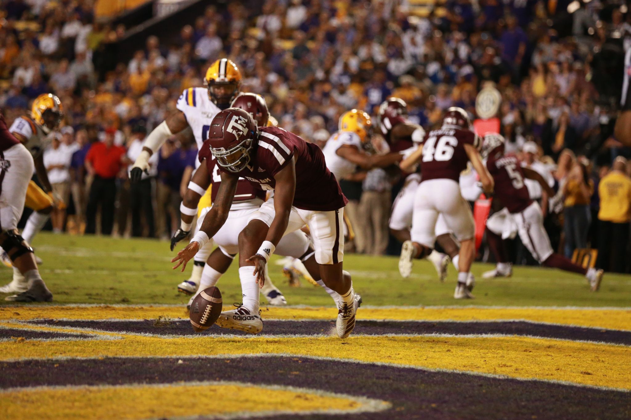 LSU center Lloyd Cushenberry III (79) and offensive tackle Saahdiq Charles  (77) celebrate a touchdown in the first half of an NCAA college football  game against Texas A&M in Baton Rouge, La.