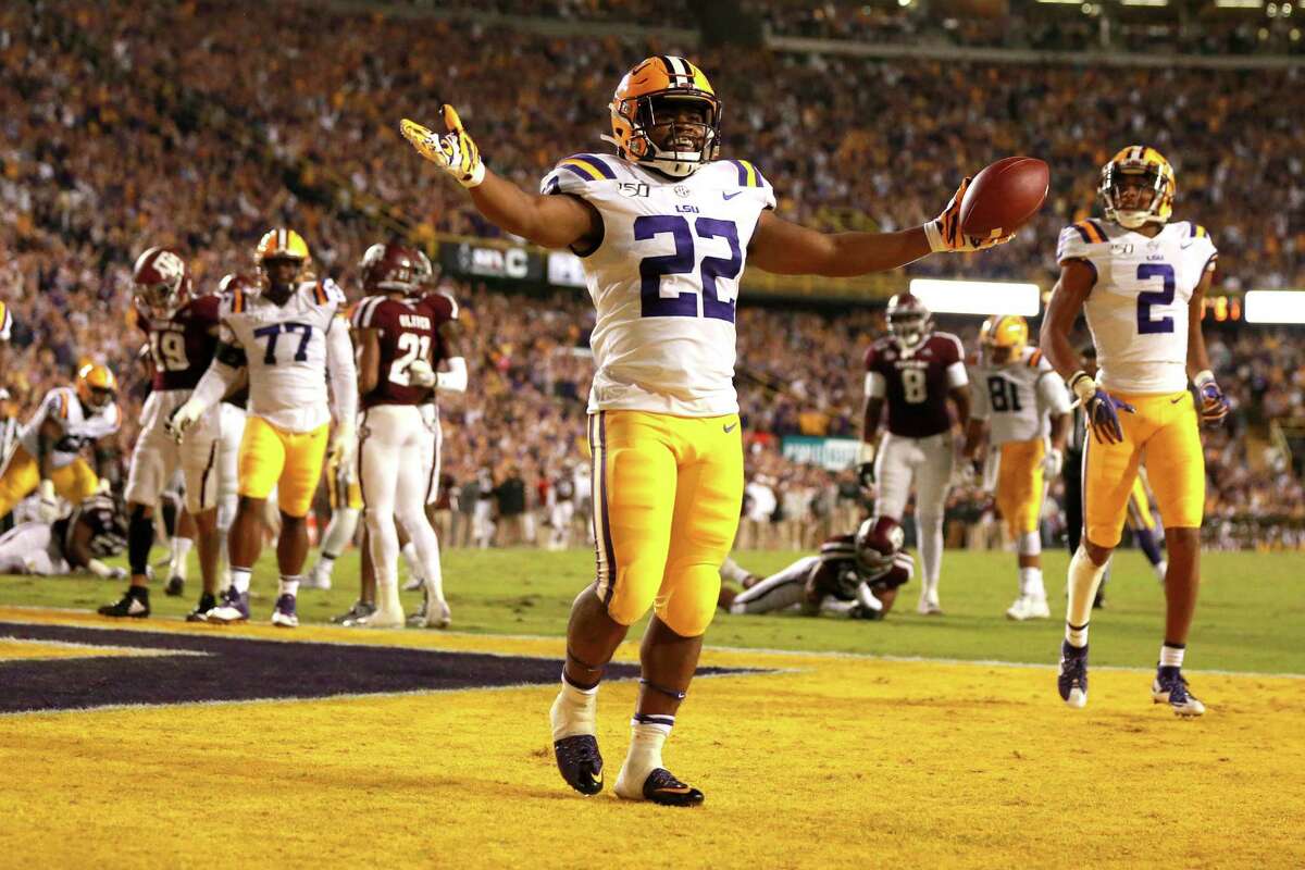 LSU’s Clyde Edwards-Helaire celebrates his 5-yard touchdown run after an opening drive that lasted just over 2 minutes. The Tigers led 34-0 by the half.