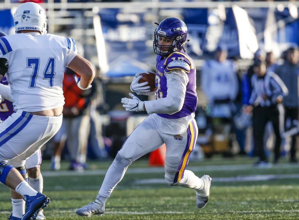 UAlbany senior defensive end Eli Mencer (#12) returns an interception as the Great Danes defeat Central Connecticut State 42-14 in the NCAA playoff at UAlbany's Casey Stadium on Nov. 30, 2019 in Albany, N.Y. (Bruce Dudek/Special to the Times Union)