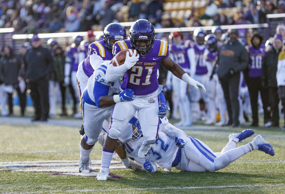 UAlbany's Karl Mofor (#21) scores a fourth quarter touchdown as the University at Albany defeats Central Connectucut State 42-14 at UAlbany's Casey Stadium, Nov, 30, 2019 in Albany, N.Y. (Bruce Dudek/Special to the Times Union)
