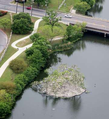 A cattle egret rookery on Bird Island in Elmendorf Lake, shown in an aerial photo April 3, 2019, will be trimmed back under a plan that seeks to reduce the risk of bird strikes involving aircraft flying to and from JBSA-Lackland.