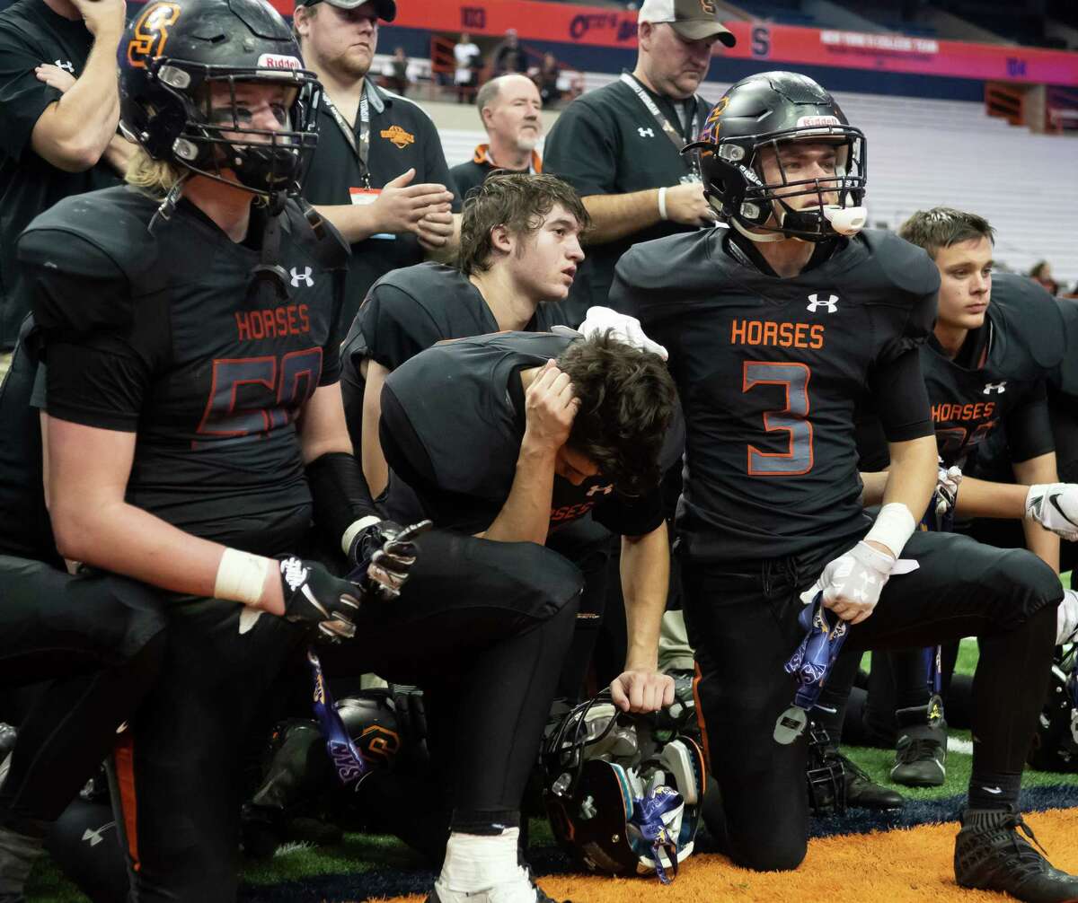 Schuylerville's Charles Luzadis (3) comforts Conner Bilinski, center, following their team's loss to Chenango Forks in the Class B State Championship on Sunday, Dec. 1, 2019, at the Carrier Dome in Syracuse, N.Y. (Jenn March, Special to the Times Union)