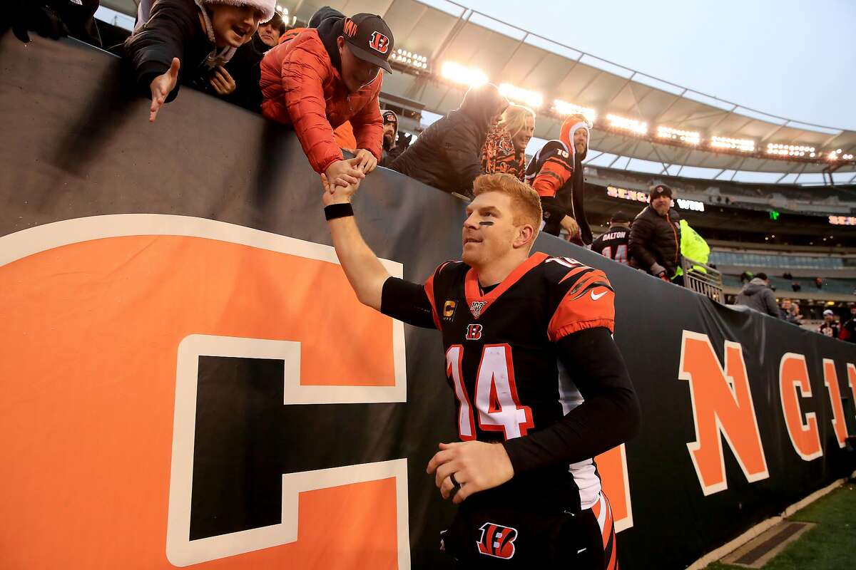 CINCINNATI, OHIO - DECEMBER 01: Andy Dalton #14 of the Cincinnati Bengals celebrates with fans after 22-6 win against the New York Jets at Paul Brown Stadium on December 01, 2019 in Cincinnati, Ohio. (Photo by Andy Lyons/Getty Images)
