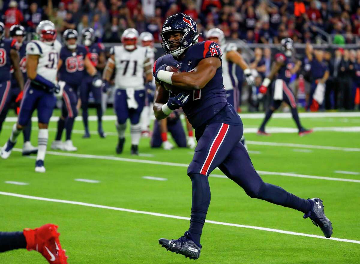 Houston Texans tight end Darren Fells (87) runs for a touchdown on a 13-yard pass from Houston Texans quarterback Deshaun Watson (4) during the second quarter of an NFL football game at NRG Stadium on Sunday, Dec. 1, 2019, in Houston.