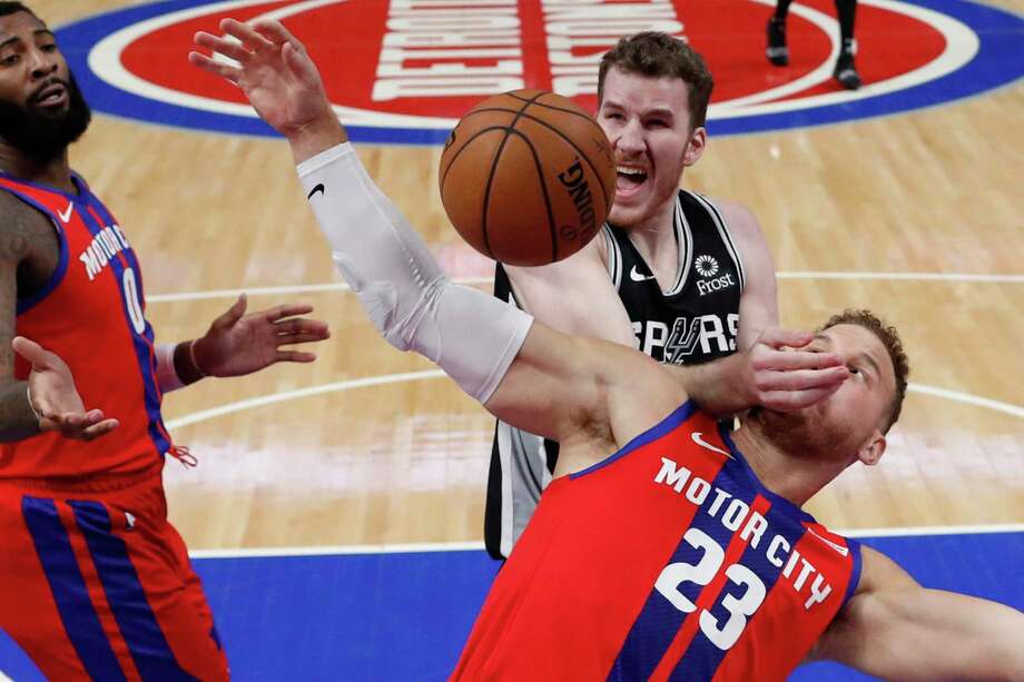 San Antonio Spurs center Jakob Poeltl fouls Detroit Pistons forward Blake Griffin (23) during the first half of an NBA basketball game, Sunday, Dec. 1, 2019, in Detroit. (AP Photo/Carlos Osorio) Photo: Carlos Osorio, STF / Associated Press / Copyright 2019 The Associated Press. All rights reserved.