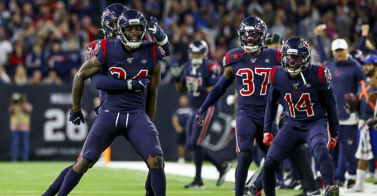 Houston Texans cornerback Johnathan Joseph (24), strong safety Justin Reid (20), strong safety Jahleel Addae (37) and wide receiver DeAndre Carter (14) react after making a stop during the third quarter of an NFL football game at NRG Stadium, Sunday, Dec. 1, 2019, in Houston.