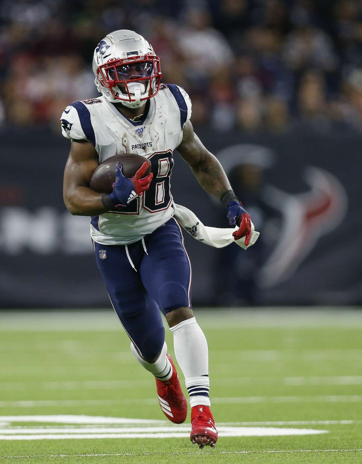 New England Patriots running back James White (28) runs the ball against the Houston Texans during the fourth quarter of an NFL game at NRG Stadium Sunday, Dec. 1, 2019, in Houston.