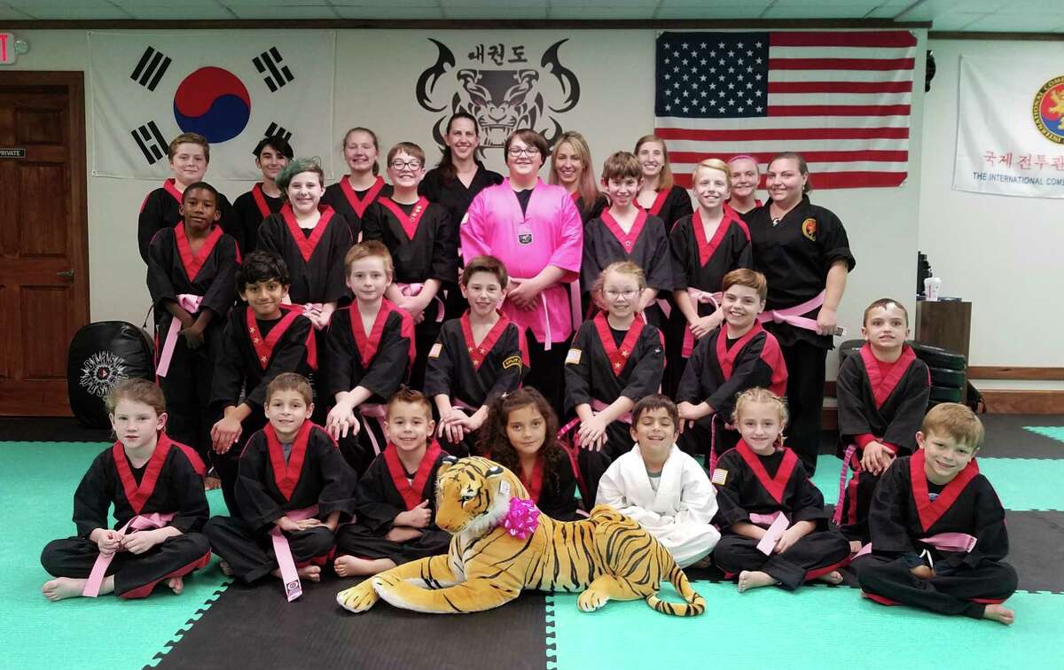 Students at American Tiger Martial Arts in Bethel helped raise money and awareness for breast cancer by purchasing a pink belt to be worn in class.