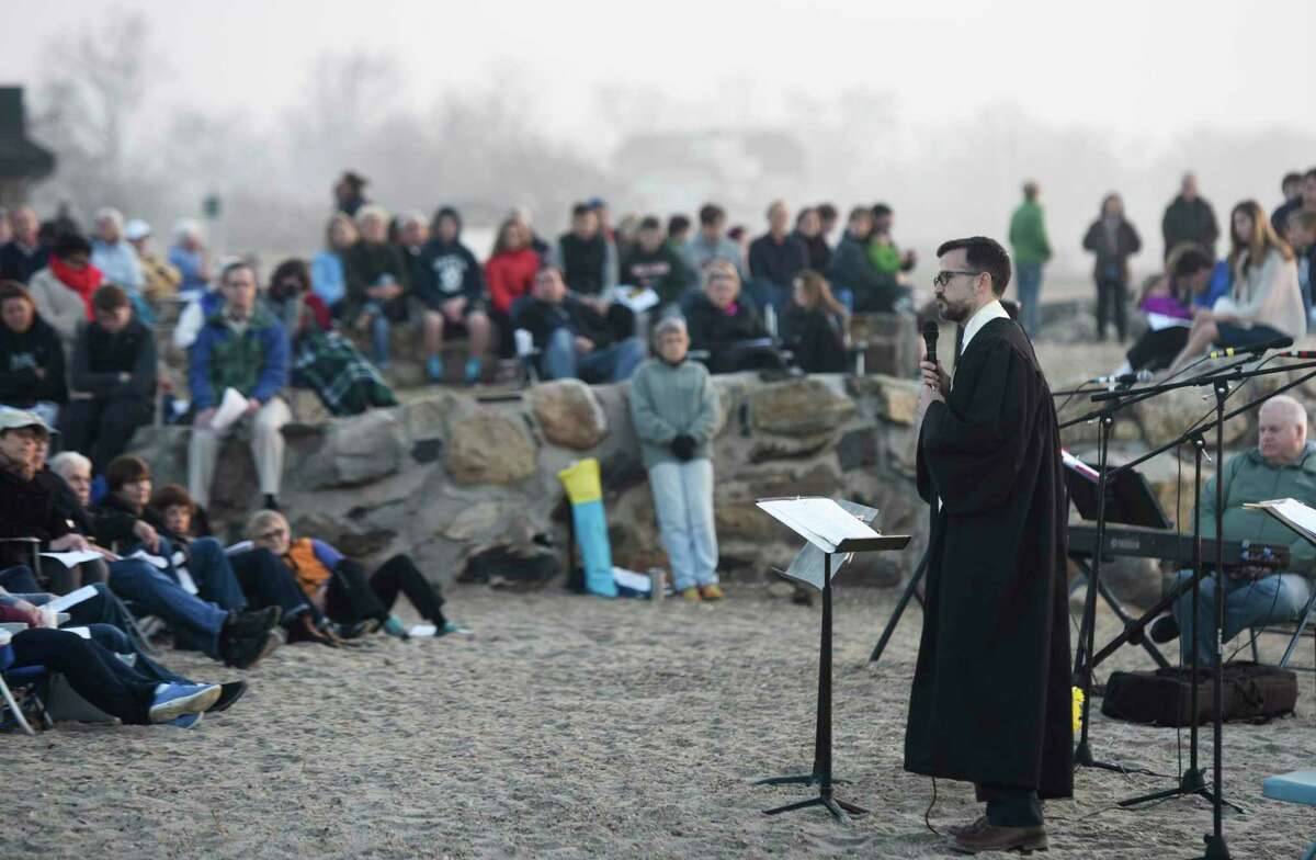 The Rev. Patrick Collins leads a prayer at First Congregational Church of Greenwich's Easter Sunrise Beach Service at Greenwich Point Park in 2017. It was announced Dec. 1 that the Rev. Patrick Collins, who has served as Associate Pastor since September 2016, will be the new Senior Pastor at FCCOG.