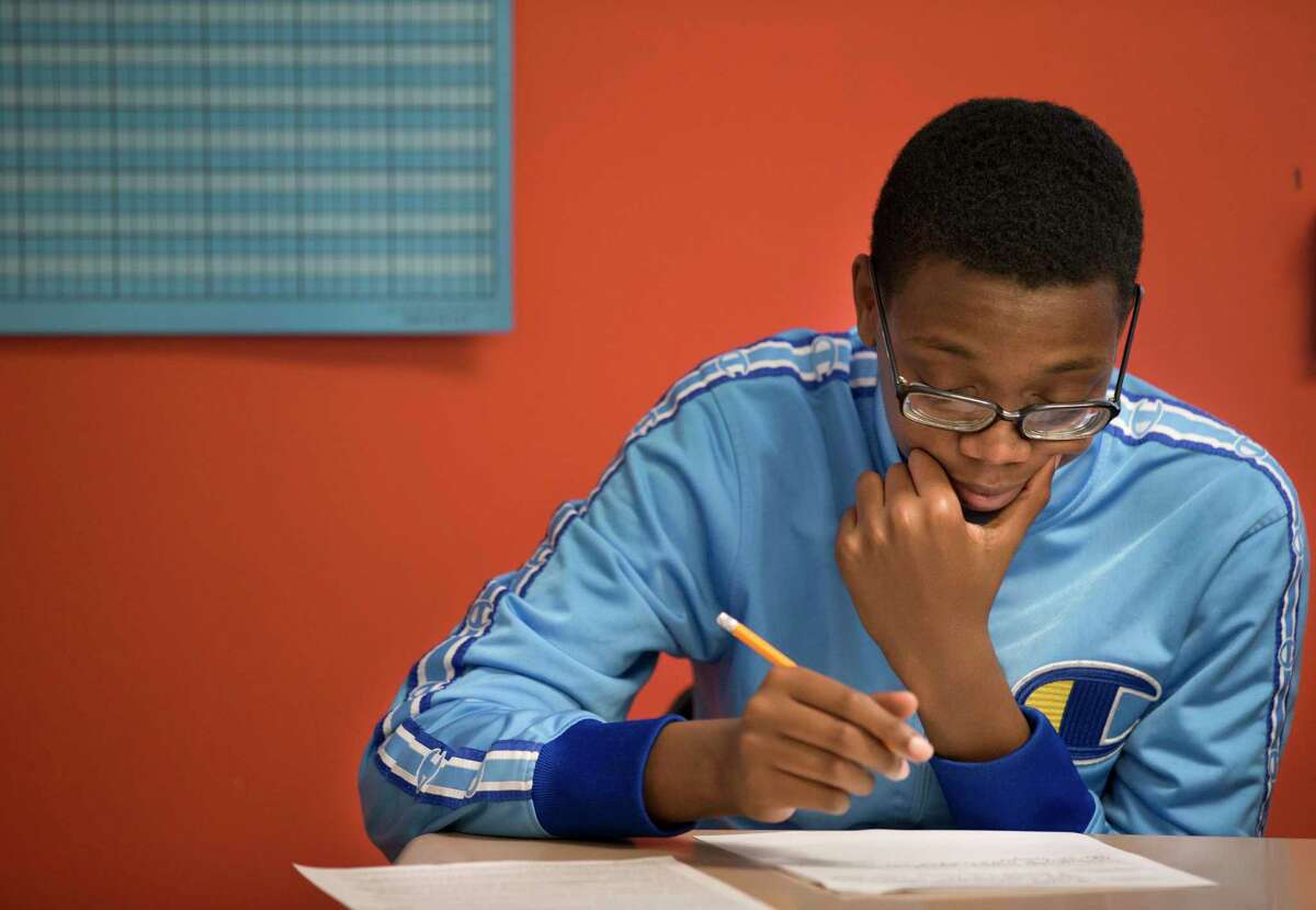 Worthing High School student Darnell Leggett works during a Miles Ahead Scholars English class on Tuesday, Oct. 29, 2019, in Houston. The program, which was piloted by state Sen. Borris Miles at the urging of Lt. Gov. Dan Patrick, identifies high-potential freshmen and sophomore male students at three HISD high school and aims to get them enrolled in the nation’s most prestigious universities.