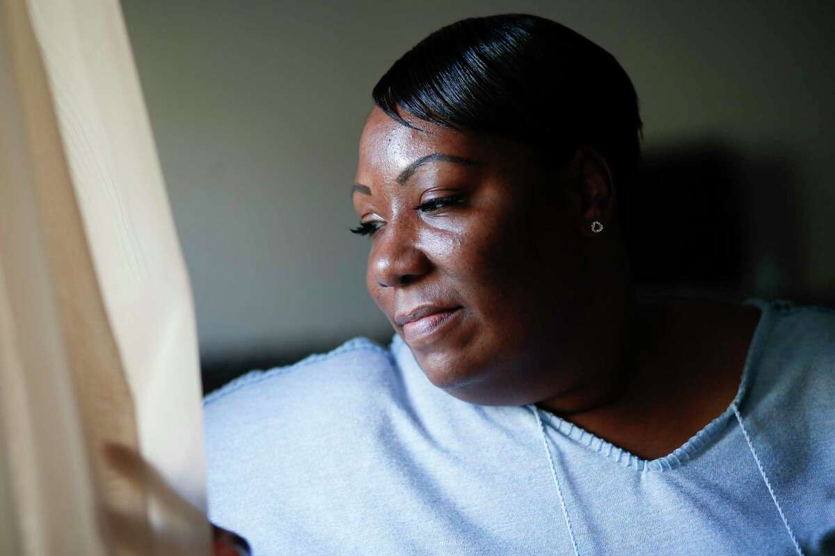 Lovinah Igbani sits in her Houston home on Sunday, Nov. 24, 2019. Igbani stayed in a shelter after leaving an abusive relationship. Currently, there's a lack of resources and funding causing thousands of victims of domestic violence to be turned away from emergency shelters this year in the Houston region.