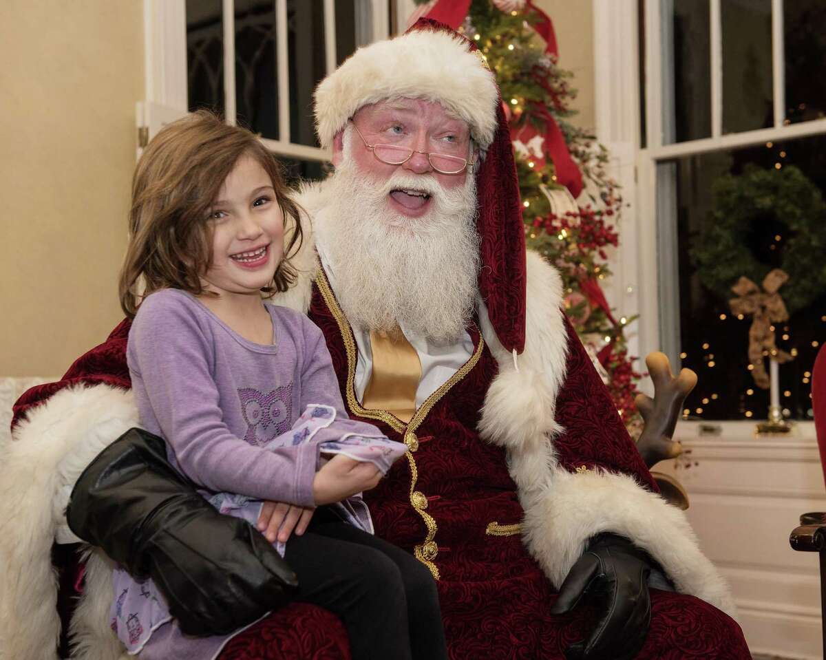 Izabella Botelho, 4, of Ridgefield meets Santa at the Lounsbury House at the annual Holiday tree-lighting on Friday, Nov. 29, 2019 in Ridgefield Conn. Izabella Botelho, 4, of Ridgefield meets Santa at the Lounsbury House at the annual Holiday tree-lighting on Friday, Nov. 29, 2019 in Ridgefield Conn.