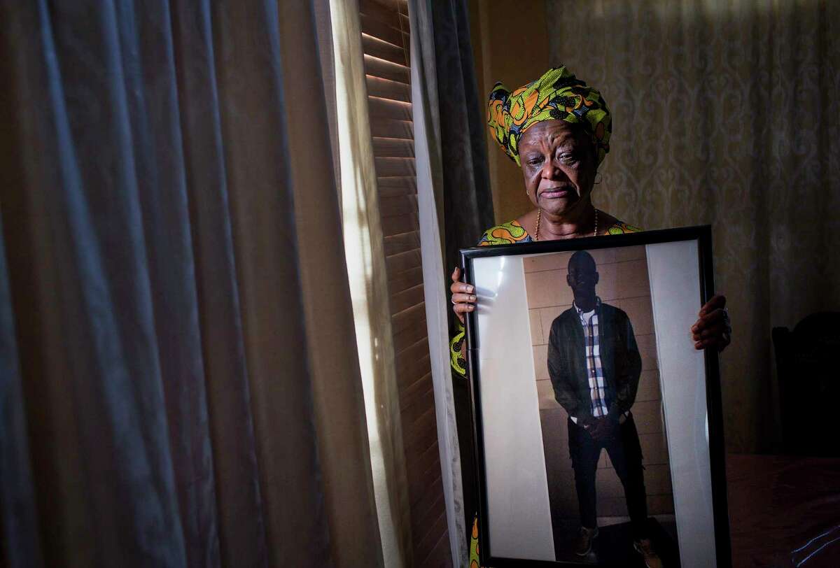 “When he got hurt, it changed my whole life,” Kadiatu Lamin said of her son, Mohamed Gordon, who fell on Monday, Oct. 21, 2019, in Missouri City. She cries while holding a photo of her son, Mohamed Gordon, in her dining room. She says he lost his sight in his right eye while in ICE custody after he wasn't given proper medical care after an altercation. "Being blind is like taking somebody's life away," she said. Her son's immigration problems began after a string of misdemeanors, which she says started when he met a new group of friends in the United States. "You come from a good home, why do you want to mingle with these people?" she asked. The family fled Sierra Leone because of the war, during which she said many members of their family were killed.