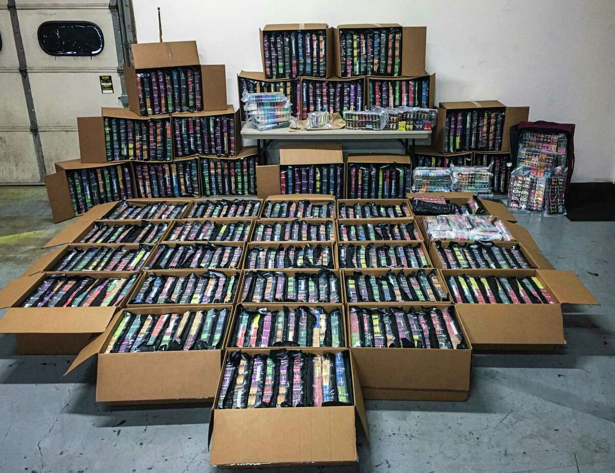 This photo provided Nov. 7, 2019, by the Minnesota Department of Public Safety shows some of the 75,000 THC vaping cartridges seized in drug busts by Minnesota's Northwest Metro Drug Task Force. (Minnesota Department of Public Safety via AP)