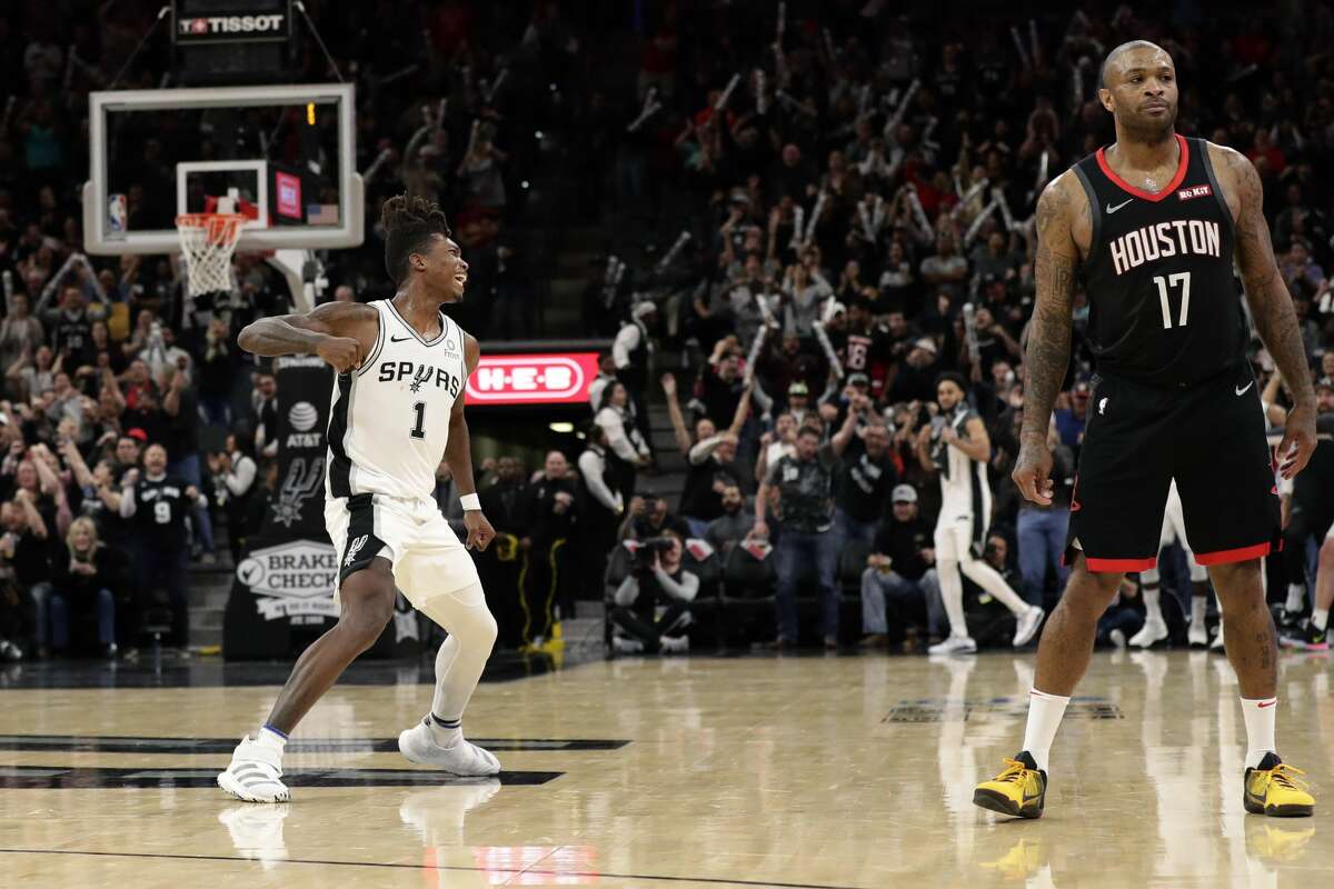 San Antonio Spurs guard Lonnie Walker IV (1) reacts after scoring to tie the score in the final seconds of the second half of an NBA basketball game against the Houston Rockets in San Antonio, Tuesday, Dec. 3, 2019. San Antonio won 135-133 in double overtime. (AP Photo/Eric Gay)