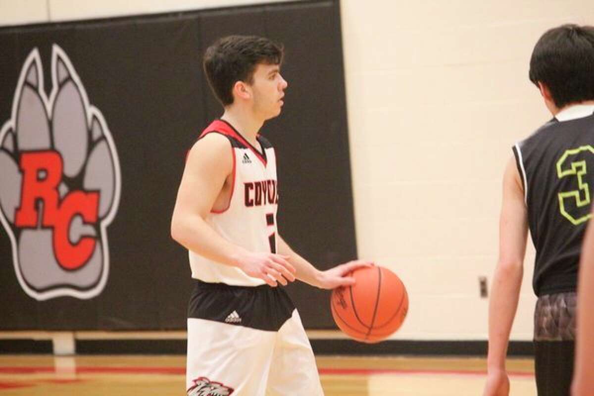 Zac Saez brings the ball down the court for Reed City last season. (Herald Review photo/John Raffel)