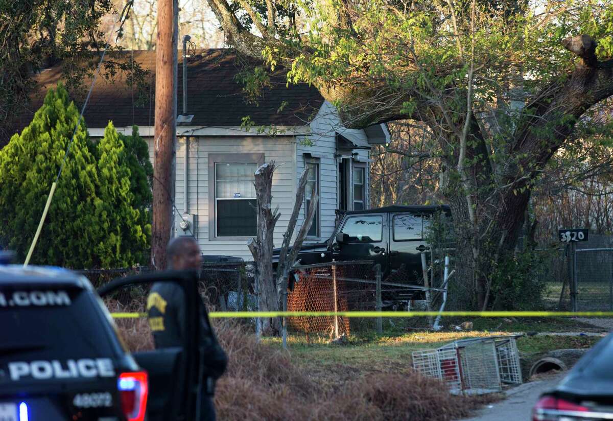 Houston Police Department officers investigate a triple shooting at Rosemont and Scott Streets where two of the victims died and one hospitalized on Wednesday, Dec. 4, 2019, in Houston. The house where the shooting happened appeared to be an illegal game room, Executive Assistant Chief Troy Finner said.