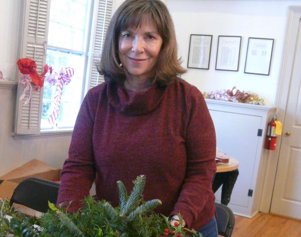 Marla Sinchak joins with other Wilton Garden Club members in creating holiday decorations.