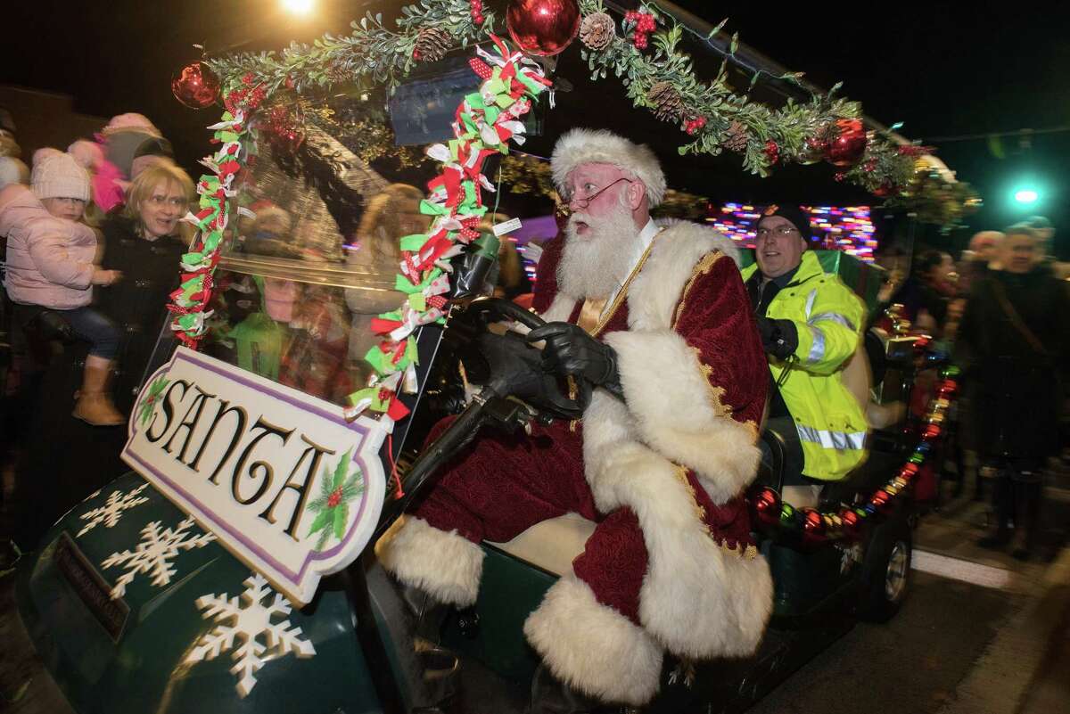 Santa and Mrs. Claus ride a golf cart to the Lounsbury House to greet Ridgefield children at the annual Holiday tree-lighting on Friday, Nov. 29, 2019 in Ridgefield Conn. Santa and Mrs. Claus ride a golf cart to the Lounsbury House to greet Ridgefield children at the annual Holiday tree-lighting on Friday, Nov. 29, 2019 in Ridgefield Conn.