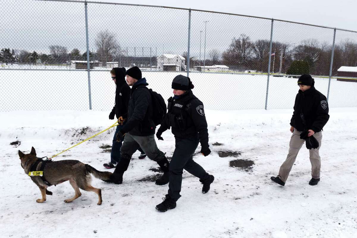 Law enforcement members from the Albany County Sheriff's Office search West Albany Pocket for a missing woman on Wednesday, Dec. 4, 2019, in Colonie, N.Y. Beverly A. Trombley has not been seen since Saturday. Her car was found near the pocket park. (Will Waldron/Times Union)