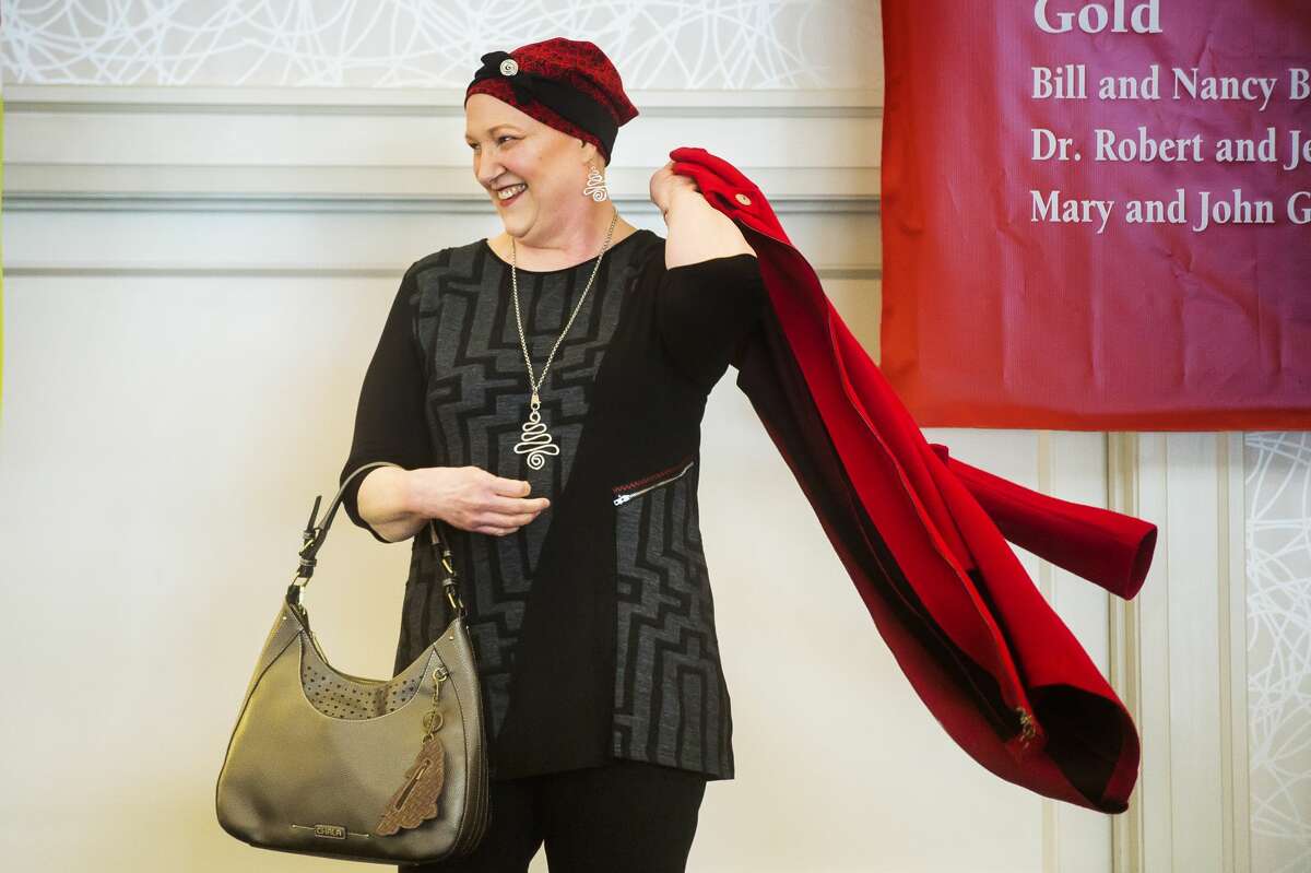 Wendy High models an outfit during Cancer Services of Midland's 28th Annual Holiday Luncheon & Style Show Wednesday, Dec. 4, 2019 at Midland Country Club. (Katy Kildee/kkildee@mdn.net)