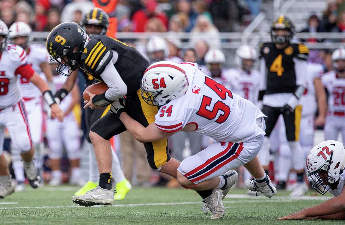 Mike Becker puts his head down to get the extra yard for Law. Foran high defeated Jonathan Law, 31-7, on Thanksgiving Day, November 28, 2019, at Jonathan Law
