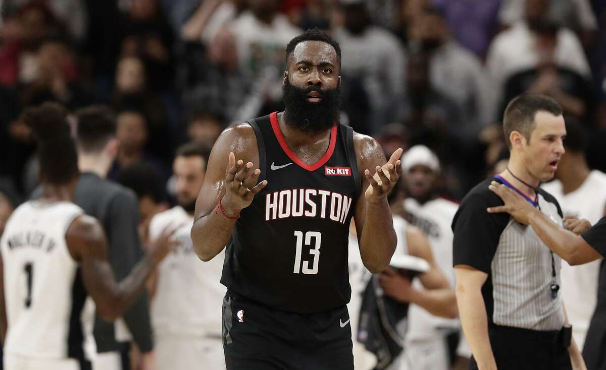 Houston Rockets guard James Harden questions a call during the second half of a game against the San Antonio Spurs. San Antonio won 135-133 in double overtime.