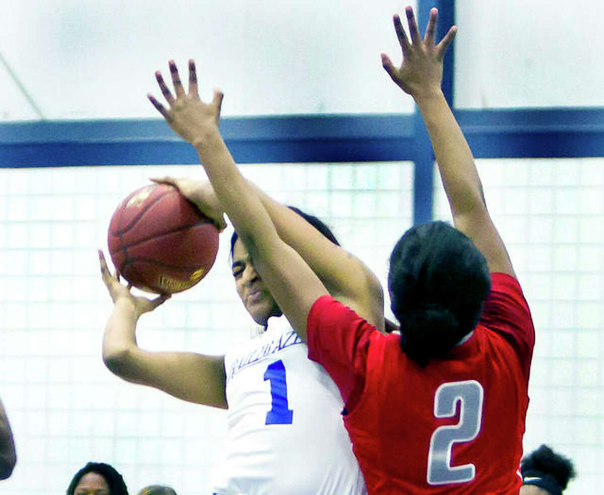 Lewis and Clark’s Shaquira Cardine (1) grabs a rebound last season against Moberly Area College. Cardine is a 5-8 sophomore from Byhalia, Mississippi, one of only three sophomores on the team.