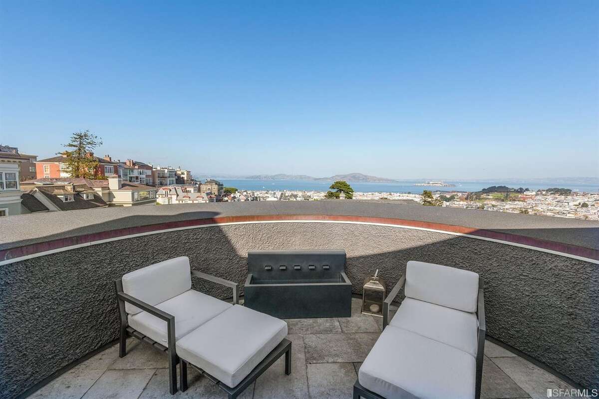 The upper floor view penthouse has a wet bar and a wraparound view patio.