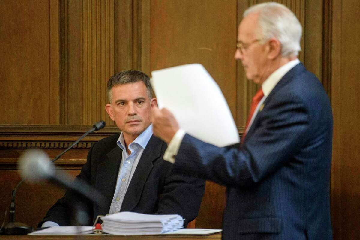 Fotis Dulos, left, is questioned by attorney Richard Weinstein, representing the estate of Hilliard Farber, during testimony in a civil case in Hartford Superior Court during his testimony in a civil case Wednesday, Dec. 4, 2019, in Hartford, Conn.