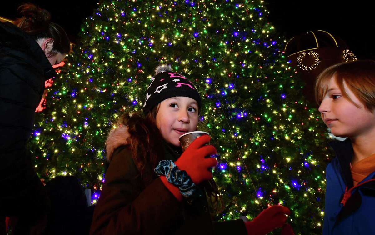 Lily Wilcox, 8, and Ethan Altieri, 9, celebrate the Stew Leonard's Tree Lighting Wednesday, December 4, 2019, at the flagship store in Norwalk, Conn.