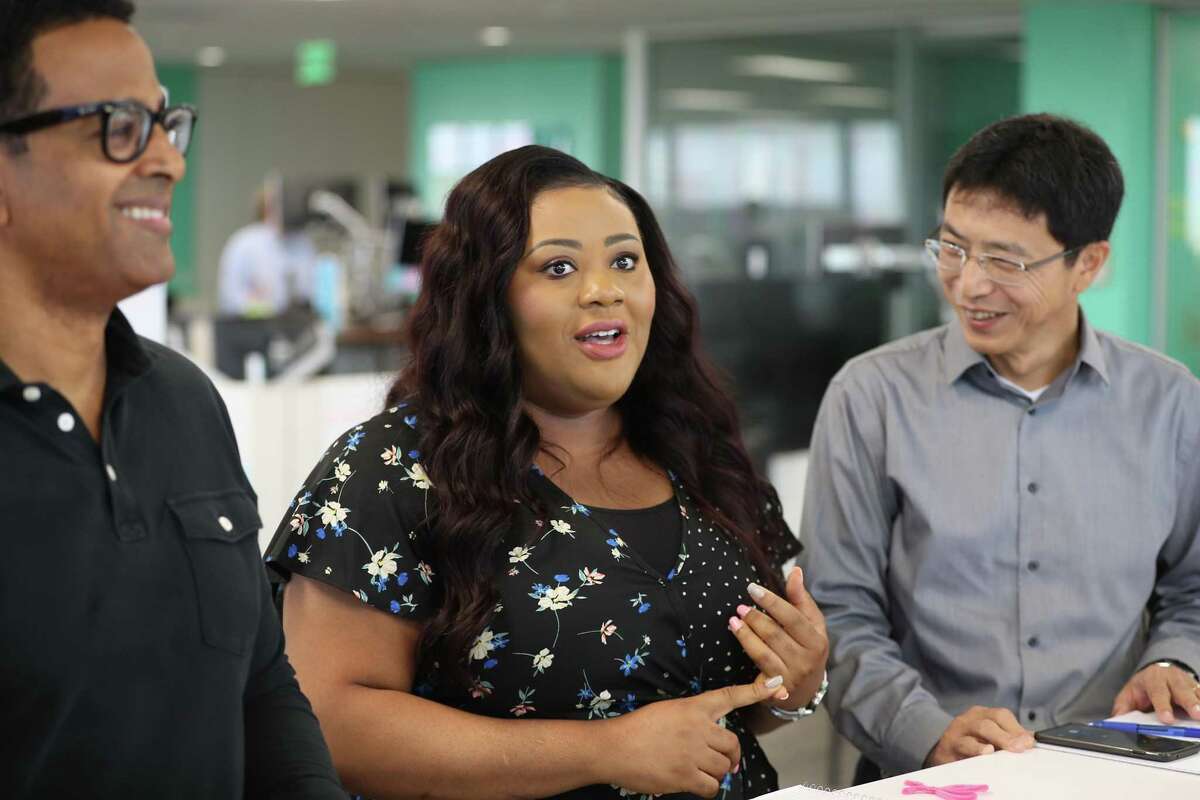 Left to Right: Yared Akalou, Francisca Okenkpu and Dongming Zhang participate in a morning scrum at Enbridge regional headquarters in Houston.