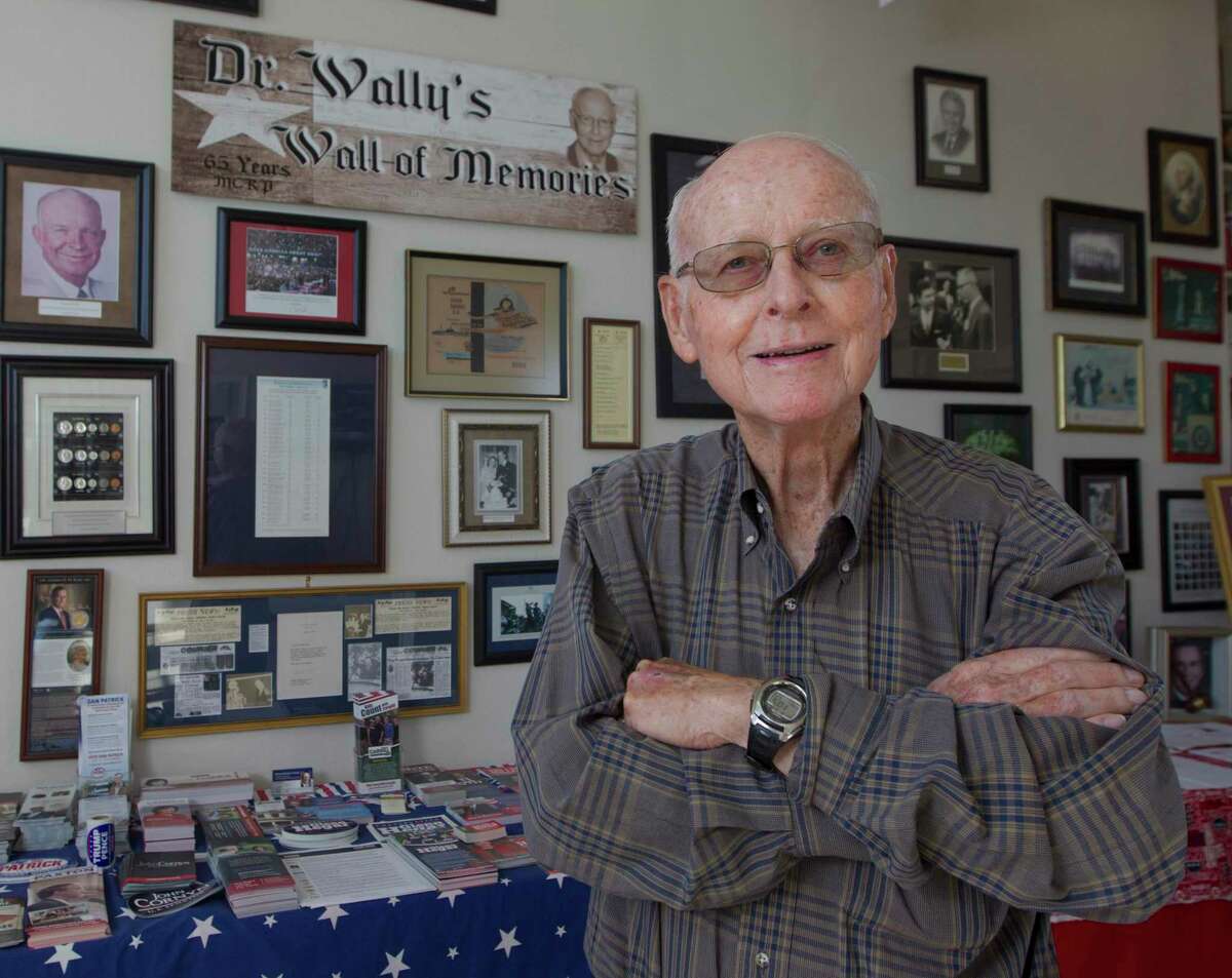 Dr. Walter “Wally” Wilkerson, who served 56 yerars as Montgomery County Republican Party chairman, poses for a portrait in front of his wall of memories at the Montgomery County Republican Headquarters, Wednesday, Dec. 5, 2018, in Conroe. Wilkerson, 91, died Friday night in Conroe.