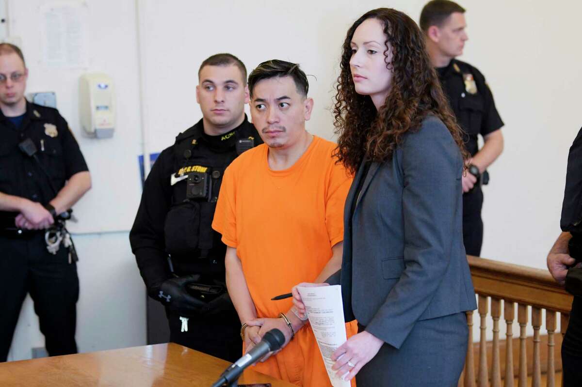 Anthony Ojeda, left, appears in Cohoes City Court for a bail hearing with his attorney, Albany County Assistant Public Defender, Angela Kelley, on Thursday, Dec. 5, 2019, in Albany, N.Y. Ojeda was indicted for murder in the death of the infant in his care. But in August 2021, he was declared a fugitive after he and his husband stopped appearing in court. (Paul Buckowski/Times Union)