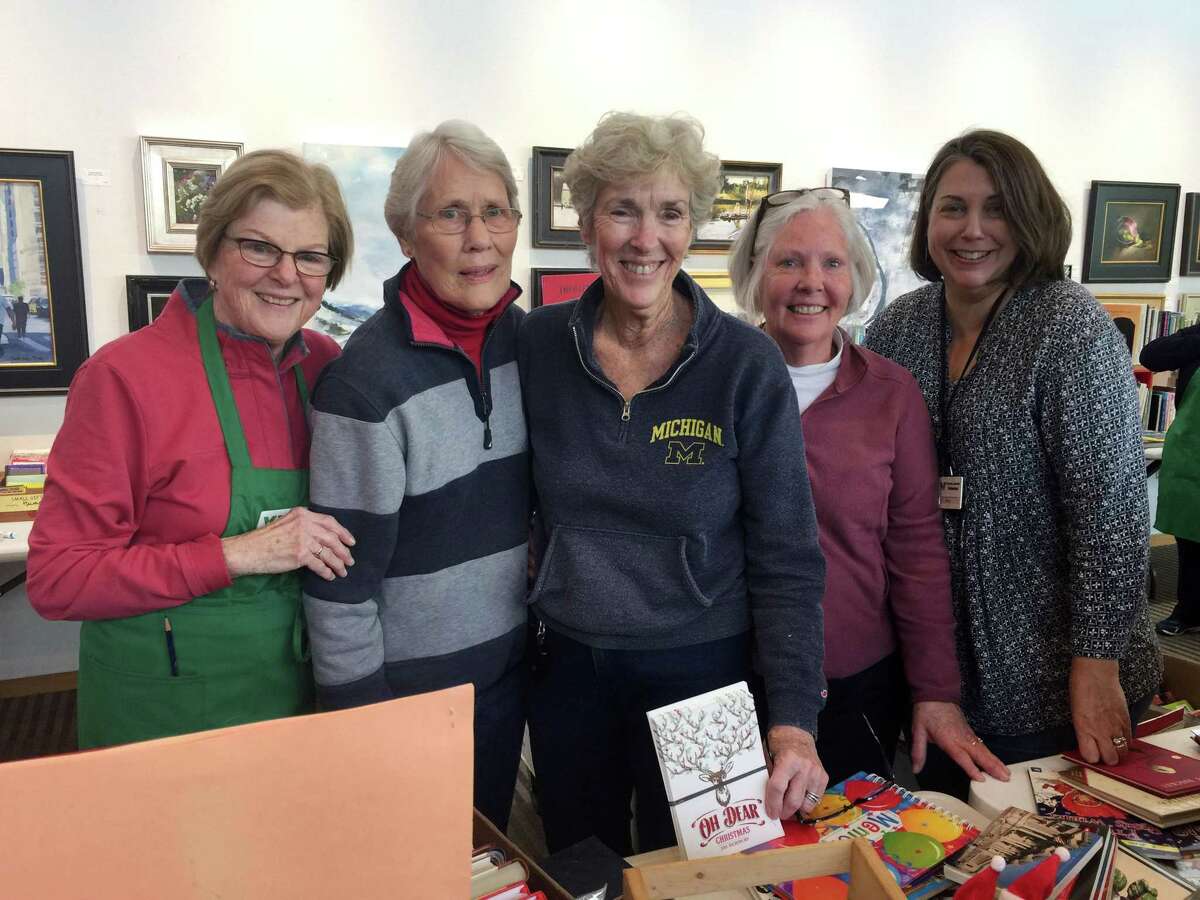 Workers at Wilton Library's holiday book sale, from left, Pat Gould, Jan MacEwan, Maureen Granito, Barbara Quist and Amy Kirk.