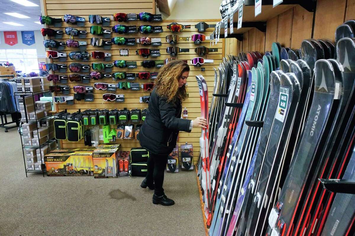 Laura Brothers of Clifton Park looks over some skis as she shopped for ski gear for her daughter, Sophia, at Alpin Haus on Wednesday, Dec. 4, 2019, in Clifton Park, N.Y. (Paul Buckowski/Times Union)