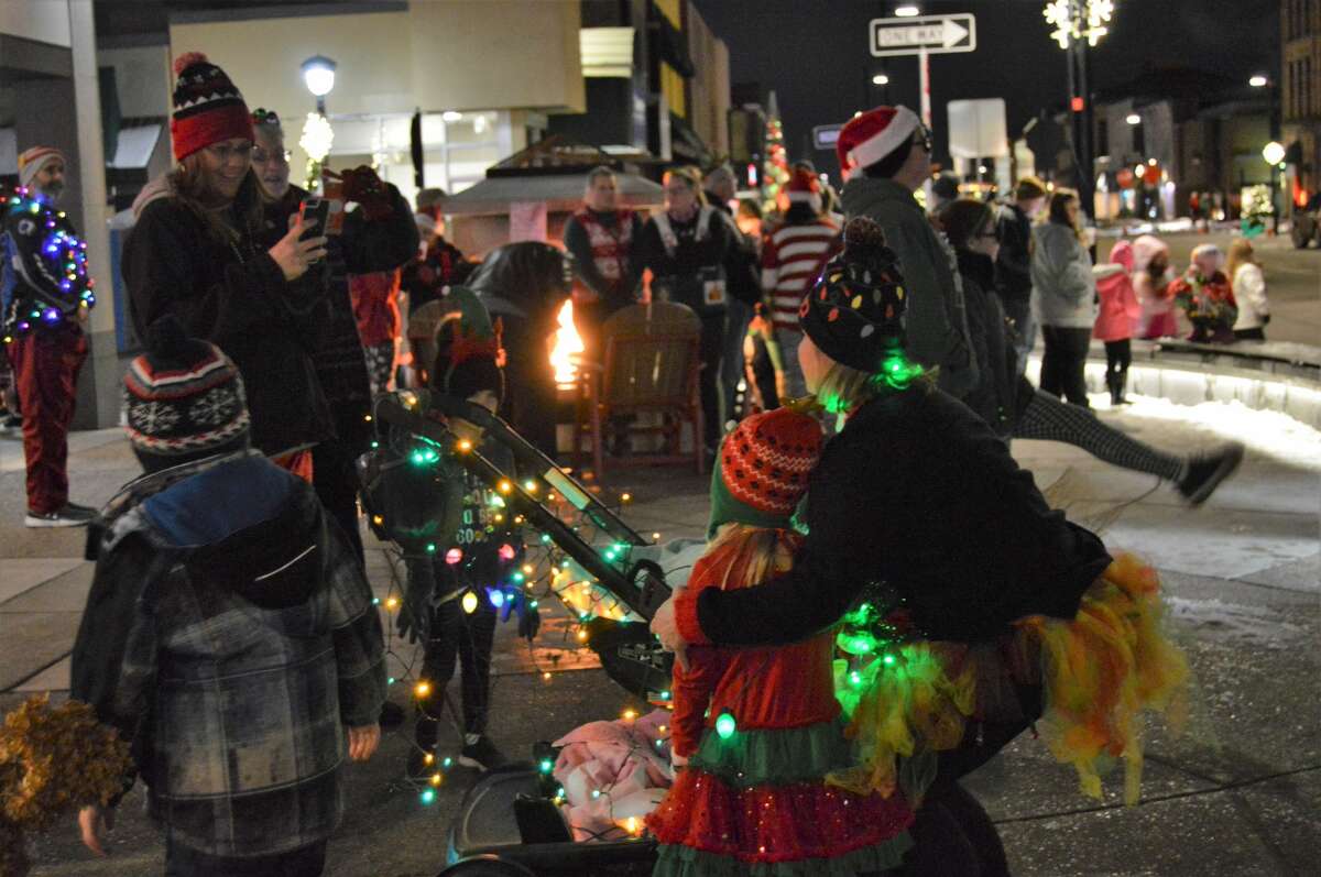 Members of the community, many of which were dressed in holiday-themed gear, gathered in downtown Midland for the Jingle Bell Fun Run/Walk on Thursday, Dec. 5, 2019. (Ashley Schafer/Ashley.Schafer@hearstnp.com)